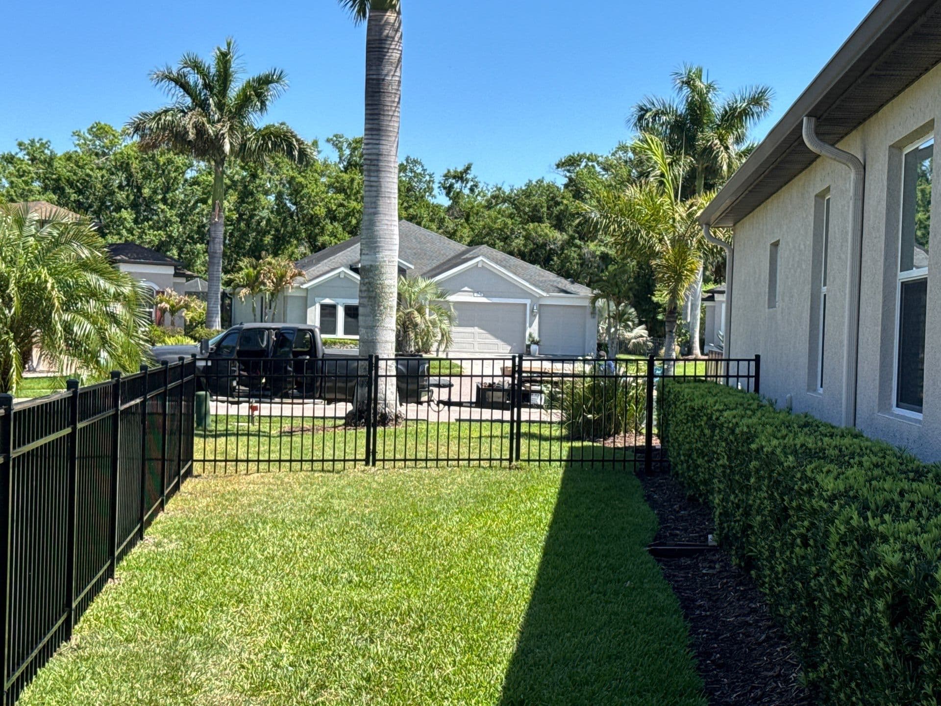 black aluminum flat_top fence installation in Bradenton, FL